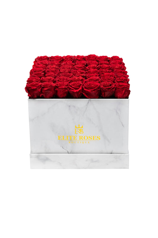Red roses in a large square box
