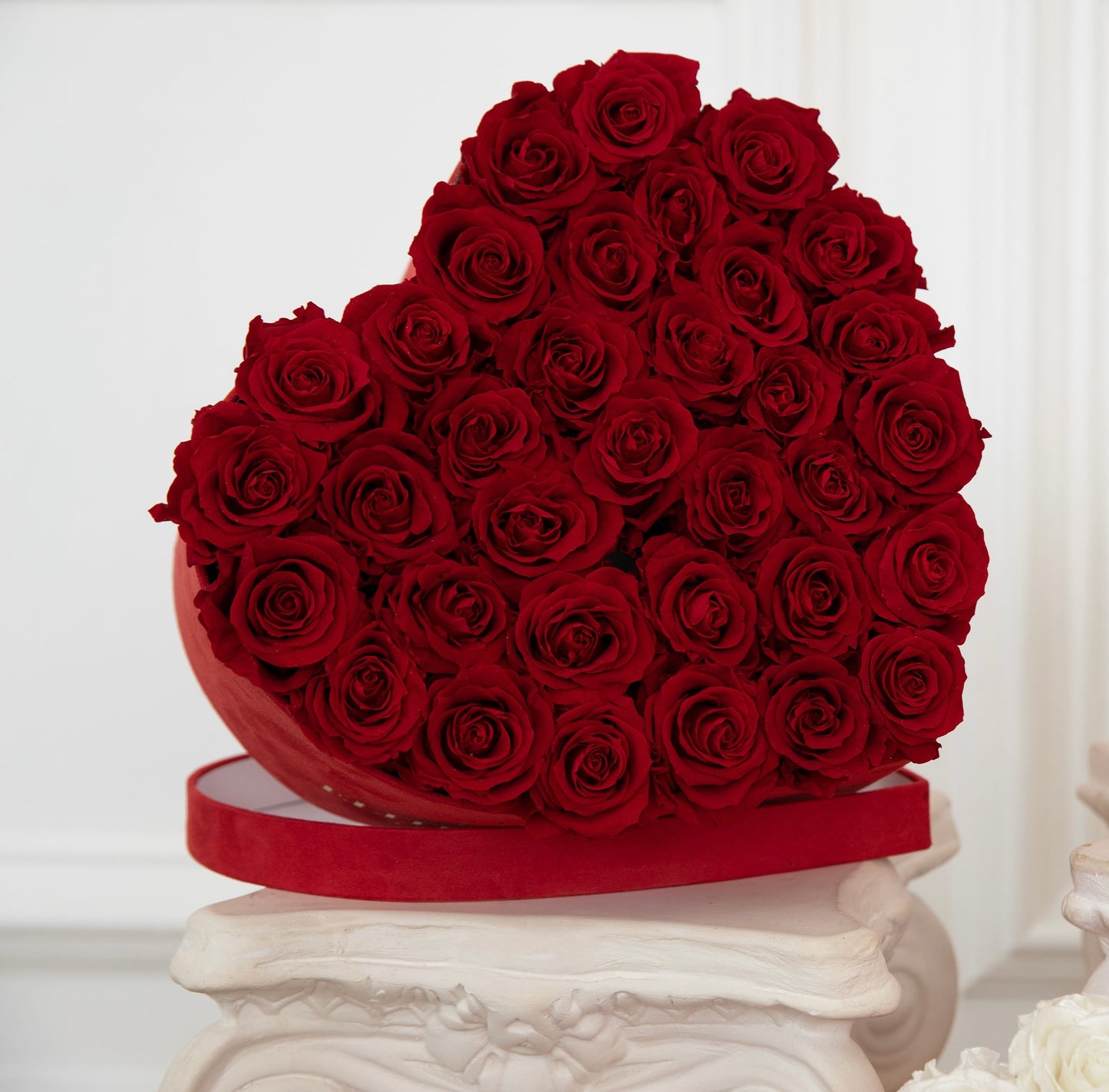 Red roses in a medium heart box