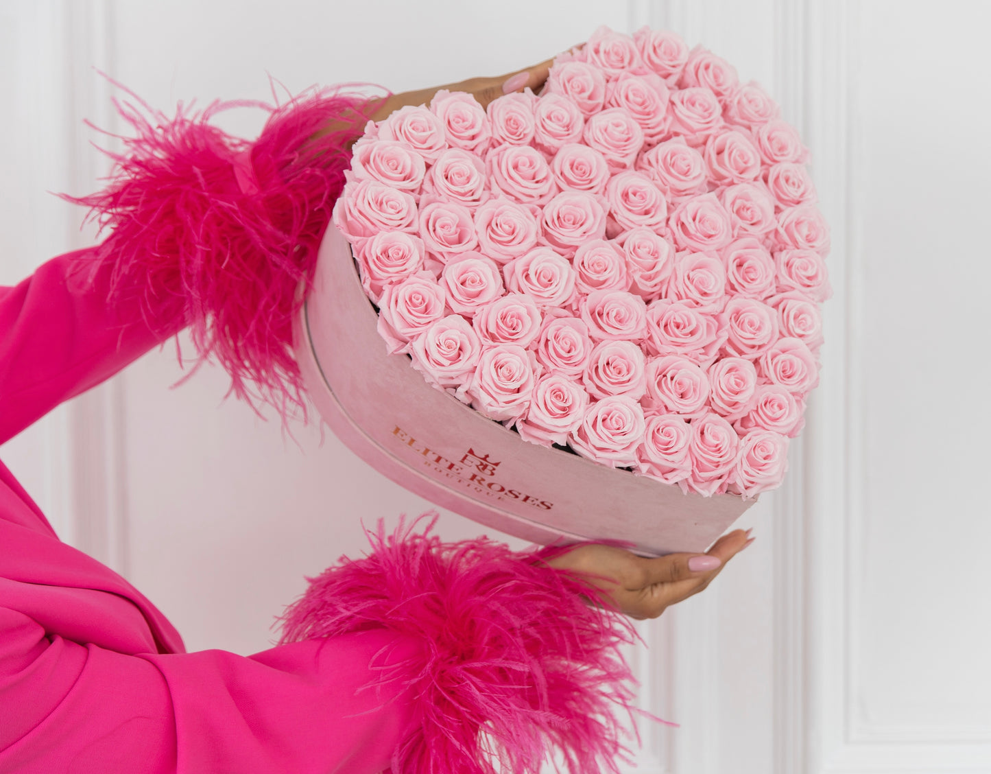 Pink roses in a large heart box