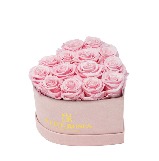 Pink roses in a small heart box